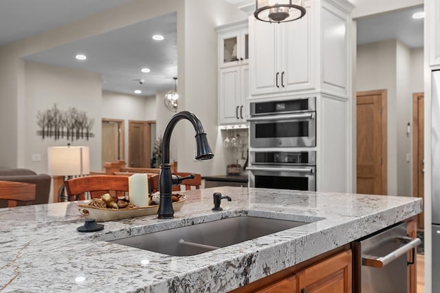 4140 N Prairie Rose Ln, Appleton, WI 54913 - kitchen featuring double oven, light stone countertops, white cabinetry, recessed lighting, and glass insert cabinets