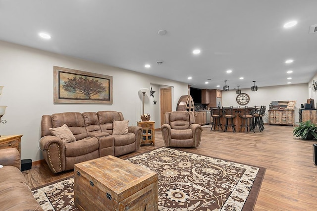 4140 N Prairie Rose Ln, Appleton, WI 54913 - living area with light wood-style floors, recessed lighting, and bar area
