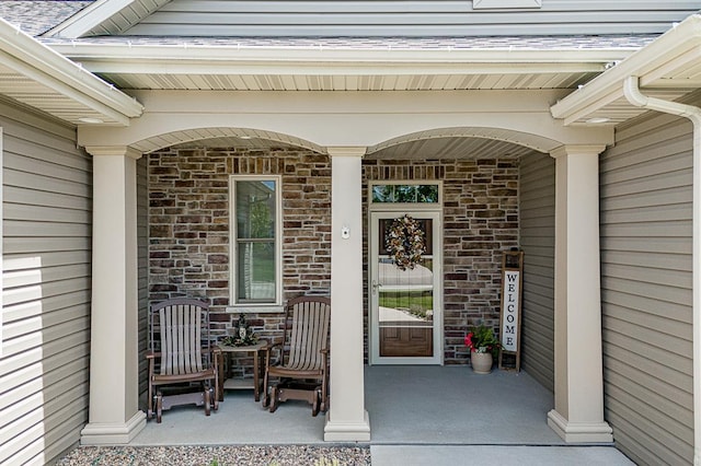 4140 N Prairie Rose Ln, Appleton, WI 54913 - view of exterior entry featuring a porch and stone siding