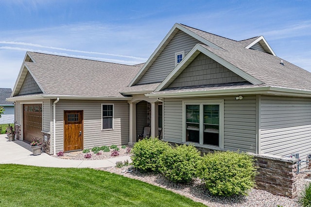 4140 N Prairie Rose Ln, Appleton, WI 54913 - view of front of house featuring roof with shingles, an attached garage, and concrete driveway