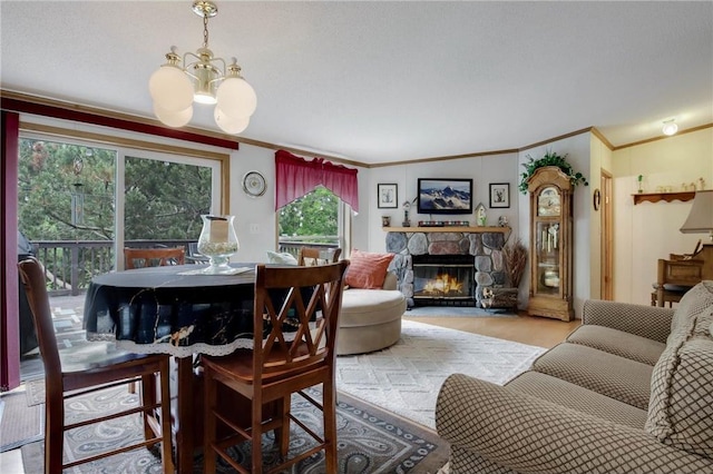 635 S 6th St, Barron, WI 54812 - dining room with a chandelier, crown molding, and a stone fireplace