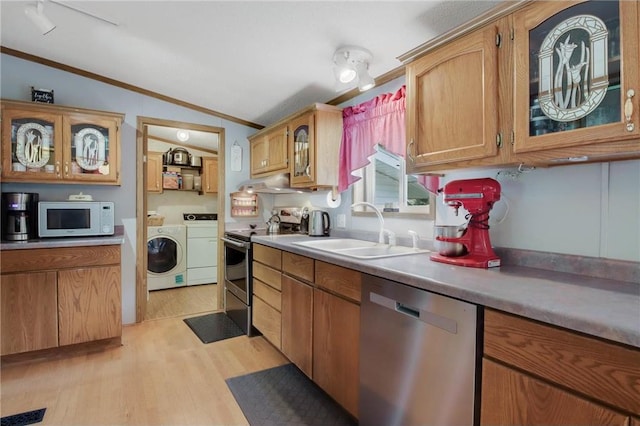 635 S 6th St, Barron, WI 54812 - kitchen with stainless steel appliances, washing machine and dryer, crown molding, lofted ceiling, and light wood finished floors