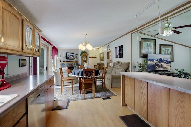 635 S 6th St, Barron, WI 54812 - dining area with light wood-type flooring, a chandelier, ceiling fan, and a stone fireplace