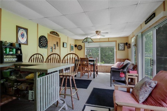 635 S 6th St, Barron, WI 54812 - dining space featuring a paneled ceiling, ceiling fan, carpet, and wainscoting