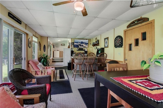 635 S 6th St, Barron, WI 54812 - carpeted dining space with a paneled ceiling, a ceiling fan, and plenty of natural light