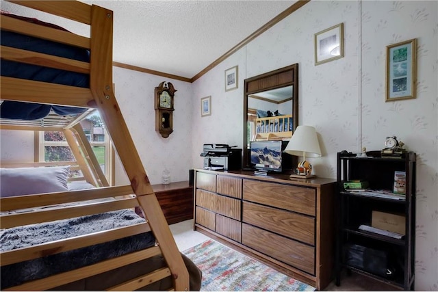 635 S 6th St, Barron, WI 54812 - bedroom with wallpapered walls, vaulted ceiling, ornamental molding, and a textured ceiling