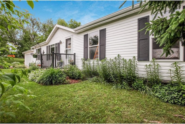 635 S 6th St, Barron, WI 54812 - view of side of home with a lawn