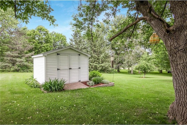 635 S 6th St, Barron, WI 54812 - view of shed featuring view of wooded area