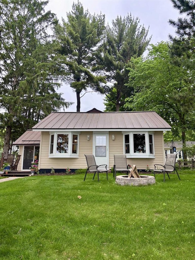 N3911 Lakeside Ln, Wautoma, WI 54982 - view of front of property featuring a front lawn and a metal roof