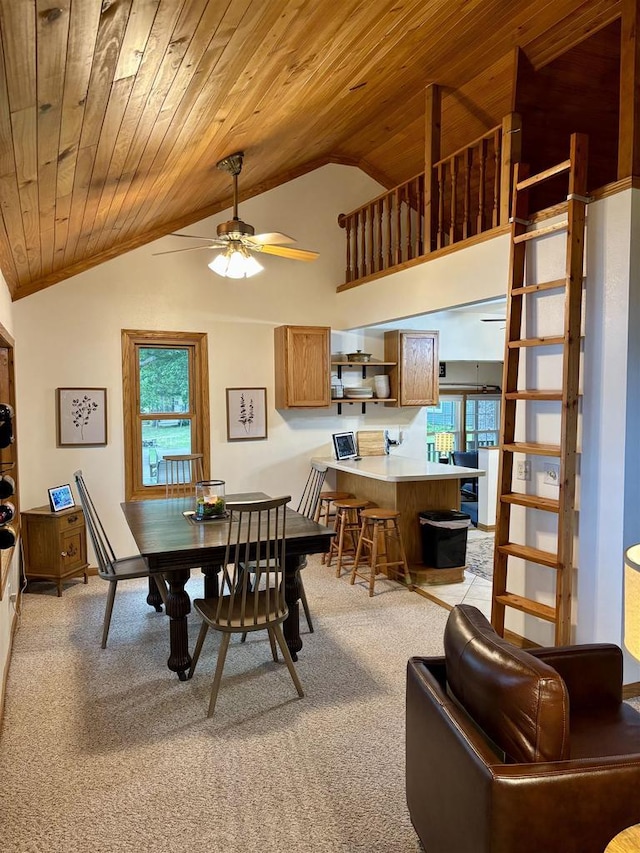N3911 Lakeside Ln, Wautoma, WI 54982 - dining room featuring lofted ceiling, wood ceiling, light colored carpet, and ceiling fan