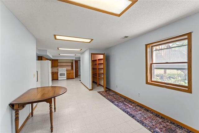 1231 135th St, Amery, WI 54001 - hallway with light floors and a textured ceiling
