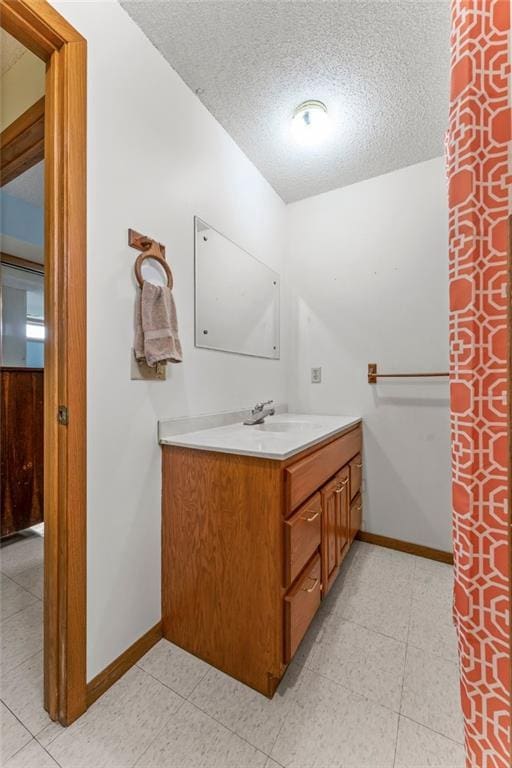 1231 135th St, Amery, WI 54001 - bathroom with vanity and a textured ceiling