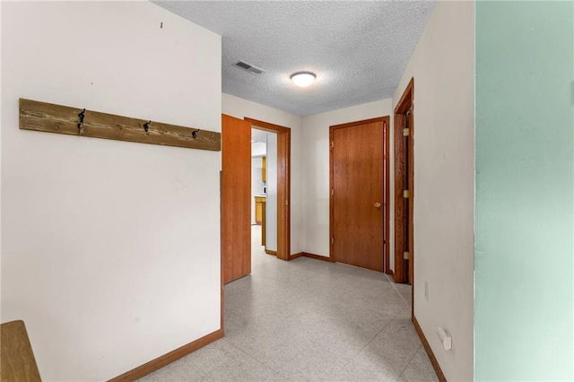 1231 135th St, Amery, WI 54001 - hallway with light flooring and a textured ceiling