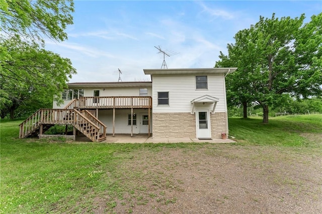 1231 135th St, Amery, WI 54001 - rear view of property with stairs, a wooden deck, a yard, and a patio area