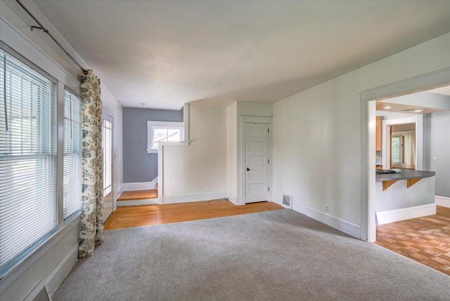 31 Elm St, Fort Atkinson, WI 53538 - empty room featuring wood finished floors and carpet flooring