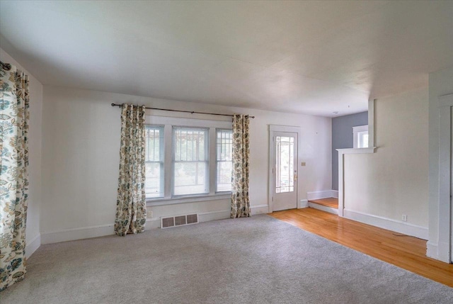 31 Elm St, Fort Atkinson, WI 53538 - unfurnished living room with carpet floors and baseboards