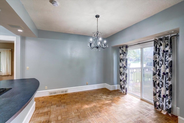 31 Elm St, Fort Atkinson, WI 53538 - dining room with a chandelier and a textured ceiling