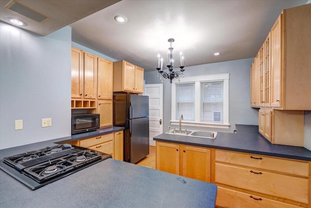 31 Elm St, Fort Atkinson, WI 53538 - kitchen featuring black appliances, a chandelier, dark countertops, light brown cabinetry, and recessed lighting