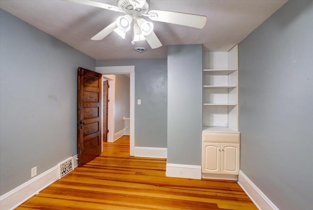 31 Elm St, Fort Atkinson, WI 53538 - unfurnished bedroom featuring light wood-type flooring and a ceiling fan