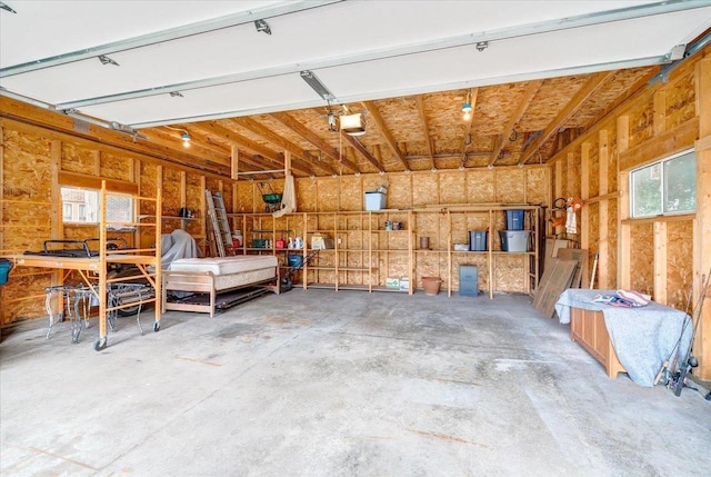 31 Elm St, Fort Atkinson, WI 53538 - garage with a garage door opener and a workshop area