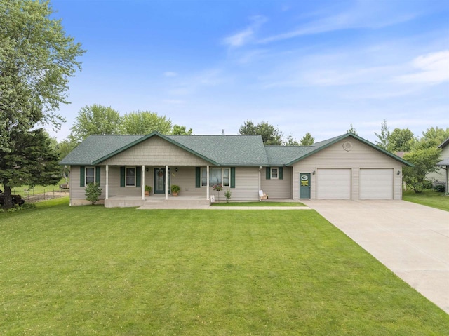 201 N 6th St, Colby, WI 54421 - ranch-style house with a porch, a garage, concrete driveway, a front lawn, and a shingled roof