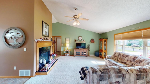201 N 6th St, Colby, WI 54421 - living area with a ceiling fan, a glass covered fireplace, vaulted ceiling, and carpet floors