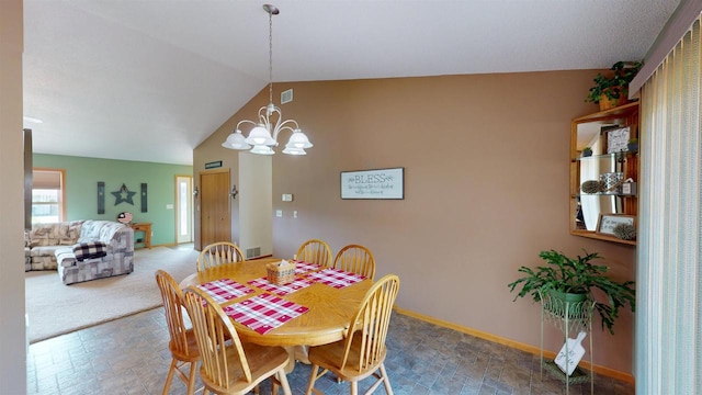 201 N 6th St, Colby, WI 54421 - dining area featuring vaulted ceiling and a chandelier