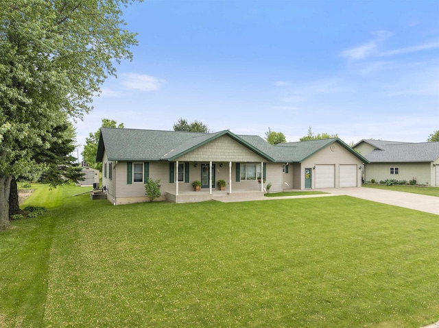 201 N 6th St, Colby, WI 54421 - ranch-style home featuring a porch, driveway, a garage, and a front yard