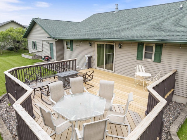 201 N 6th St, Colby, WI 54421 - wooden deck featuring outdoor dining space and a lawn