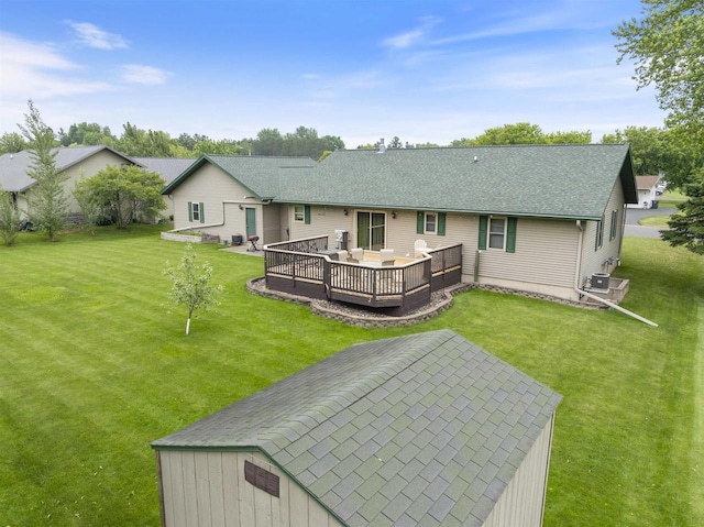 201 N 6th St, Colby, WI 54421 - back of property with a yard, a deck, and a shingled roof
