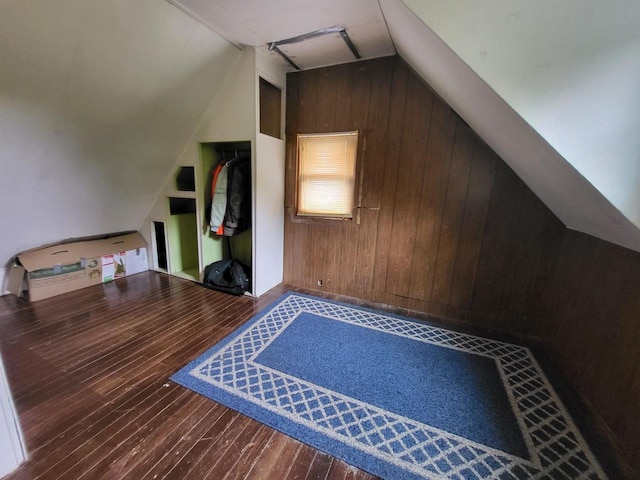 9317 N Arrowhead Shores Rd, Edgerton, WI 53534 - bonus room featuring lofted ceiling, wooden walls, and hardwood / wood-style flooring