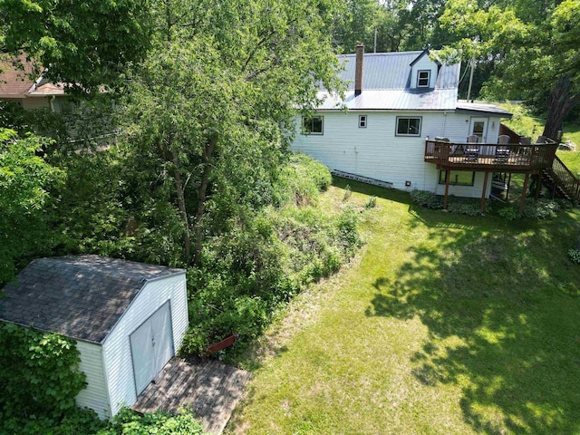 9317 N Arrowhead Shores Rd, Edgerton, WI 53534 - view of green lawn with a deck, stairway, and a storage shed