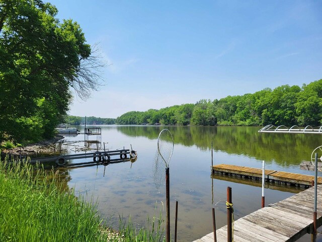 9317 N Arrowhead Shores Rd, Edgerton, WI 53534 - dock featuring a water view and a forest view