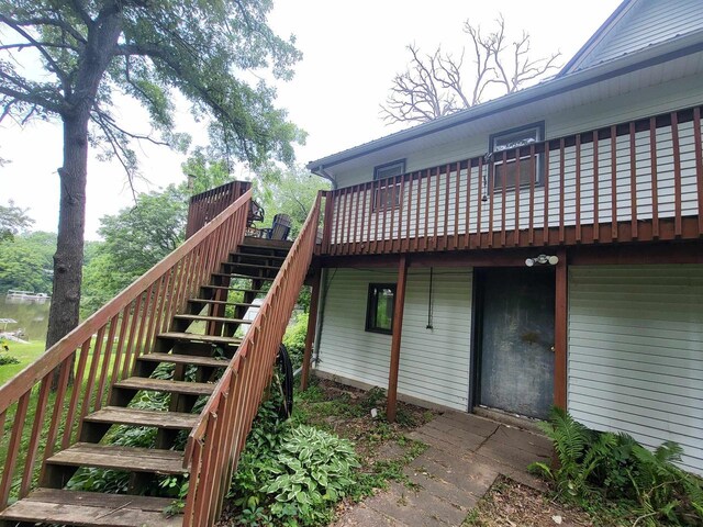9317 N Arrowhead Shores Rd, Edgerton, WI 53534 - back of property featuring stairway and a deck