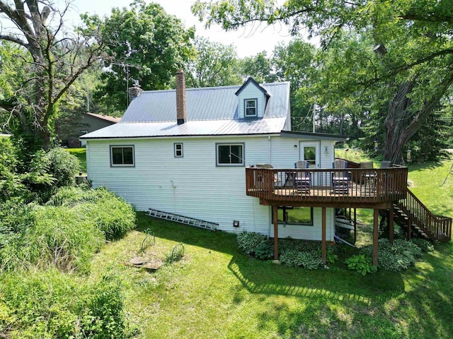 9317 N Arrowhead Shores Rd, Edgerton, WI 53534 - back of property with a wooden deck, a yard, and stairway