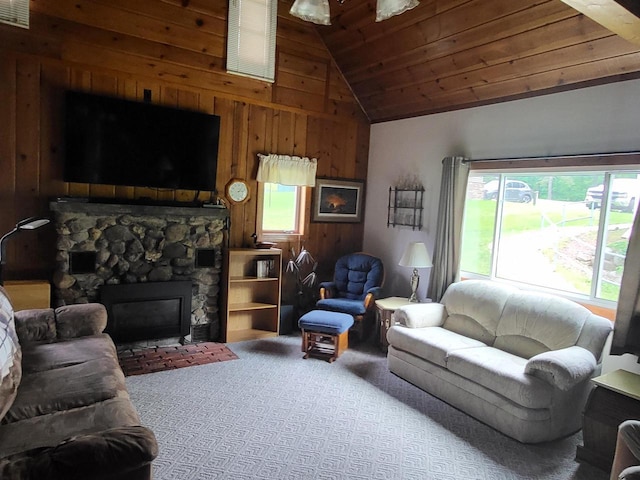 9317 N Arrowhead Shores Rd, Edgerton, WI 53534 - living area featuring plenty of natural light, wood walls, wooden ceiling, carpet, and a stone fireplace