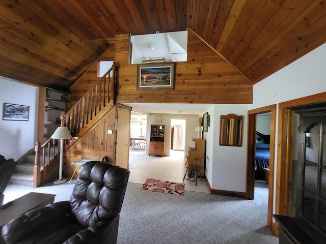 9317 N Arrowhead Shores Rd, Edgerton, WI 53534 - living room with stairs, wooden ceiling, high vaulted ceiling, wooden walls, and light tile patterned floors