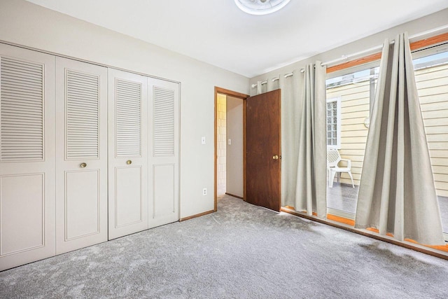 W166N9162 Grand Ave Unit 2, Menomonee Falls, WI 53051 - unfurnished bedroom featuring carpet floors and a closet