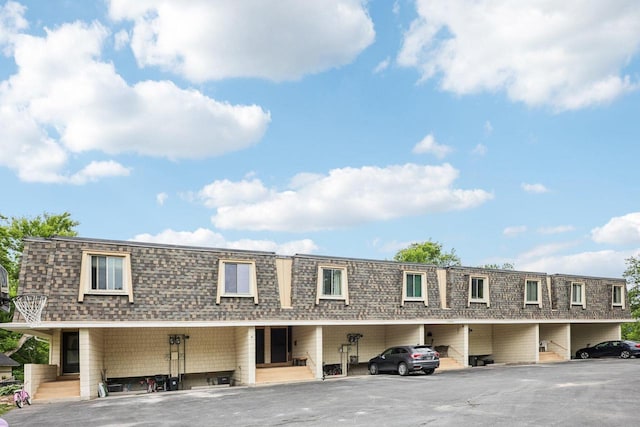 W166N9162 Grand Ave Unit 2, Menomonee Falls, WI 53051 - view of property featuring covered parking