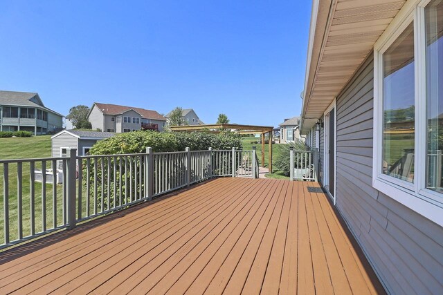 329 S Stone Ridge Dr, Lake Geneva, WI 53147 - deck with a storage shed, a residential view, and a lawn
