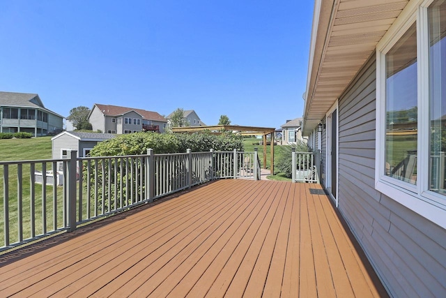 329 S Stone Ridge Dr, Lake Geneva, WI 53147 - wooden deck with a shed, a residential view, and a lawn
