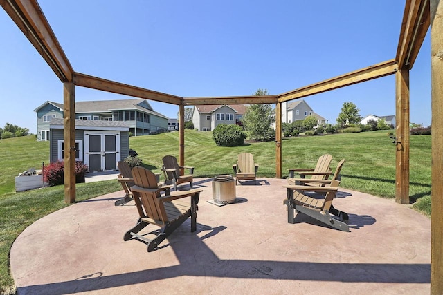 329 S Stone Ridge Dr, Lake Geneva, WI 53147 - view of patio / terrace featuring an outdoor fire pit and an outdoor structure