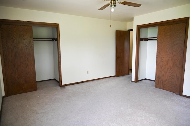 5905-5907 Rattman Rd, Madison, WI 53718 - unfurnished bedroom featuring carpet, multiple closets, and ceiling fan