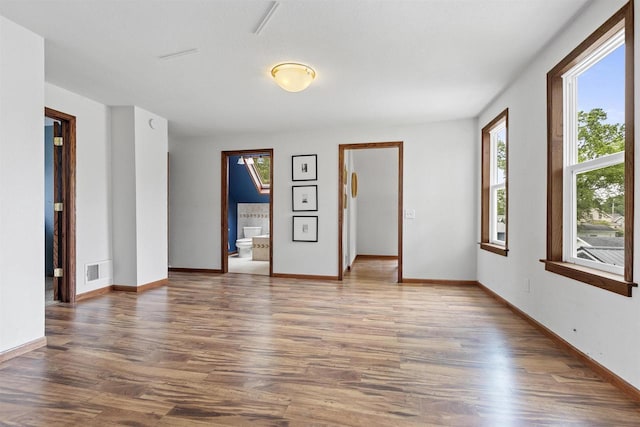 914 W 5th Ave, Oshkosh, WI 54902 - spare room with wood finished floors