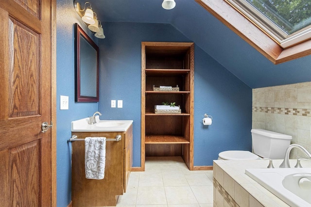 914 W 5th Ave, Oshkosh, WI 54902 - bathroom featuring lofted ceiling, vanity, tiled tub, a skylight, and tile patterned floors