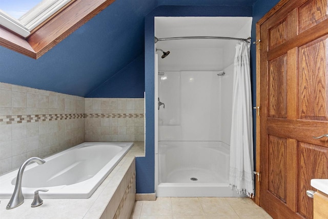 914 W 5th Ave, Oshkosh, WI 54902 - full bath featuring tile patterned flooring, a bath, vaulted ceiling, and a shower with shower curtain