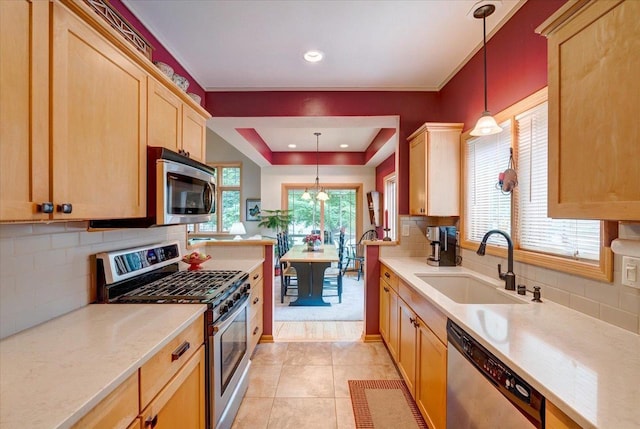14 Wood Brook Way, Fitchburg, WI 53711 - kitchen with stainless steel appliances, light countertops, tasteful backsplash, and recessed lighting
