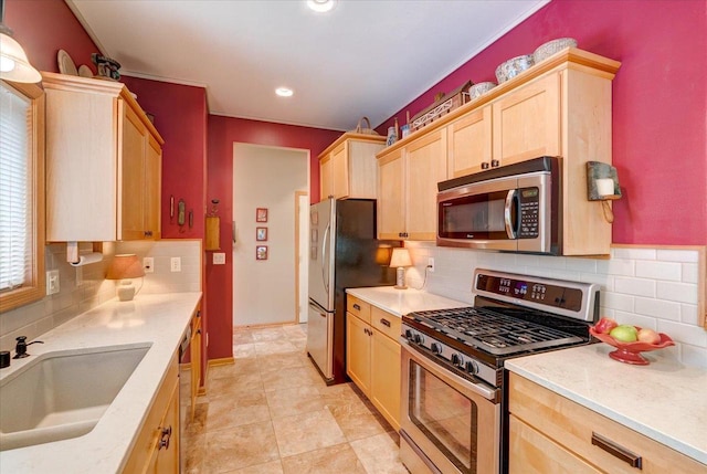 14 Wood Brook Way, Fitchburg, WI 53711 - kitchen with stainless steel appliances, light brown cabinetry, light countertops, backsplash, and recessed lighting