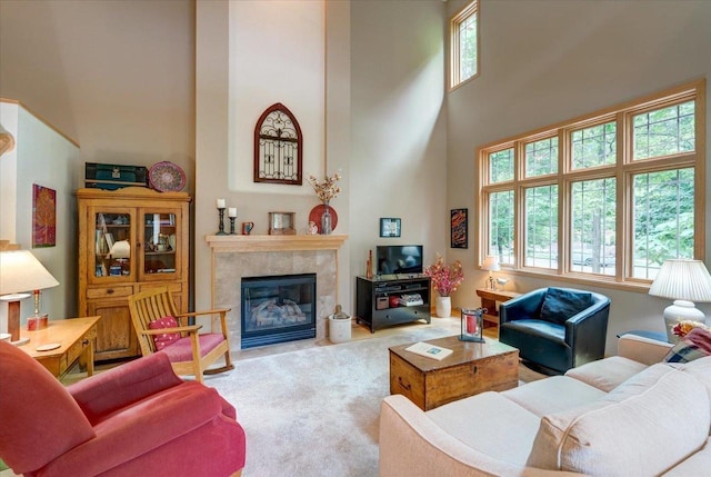 14 Wood Brook Way, Fitchburg, WI 53711 - living area featuring a towering ceiling, carpet floors, and a tile fireplace