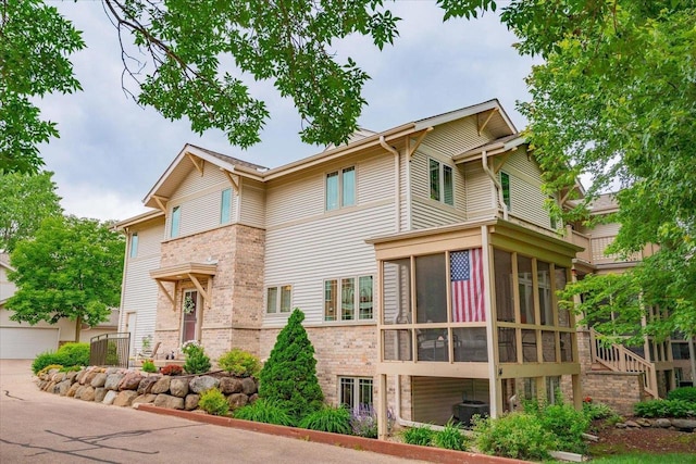 14 Wood Brook Way, Fitchburg, WI 53711 - view of front of property with a sunroom and brick siding
